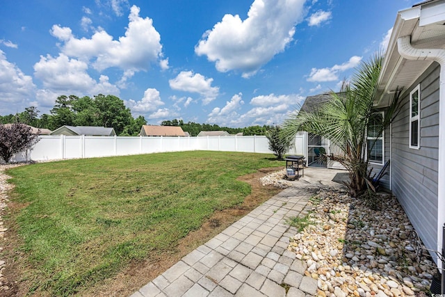 308 Millbrook Cir, Aynor, SC 29544 - fenced backyard with a patio area