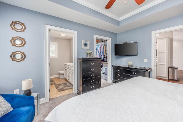 308 Millbrook Cir, Aynor, SC 29544 - bedroom featuring crown molding, a walk in closet, light colored carpet, ensuite bath, and ceiling fan