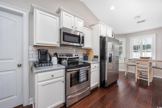 308 Millbrook Cir, Aynor, SC 29544 - kitchen with stainless steel appliances, light countertops, tasteful backsplash, white cabinets, and dark wood-style floors