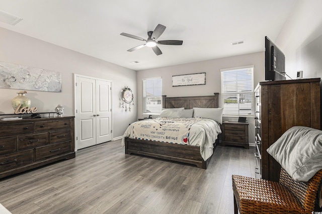 312 Cattle Drive Cir, Myrtle Beach, SC 29588 - bedroom featuring multiple windows, light wood finished floors, and ceiling fan
