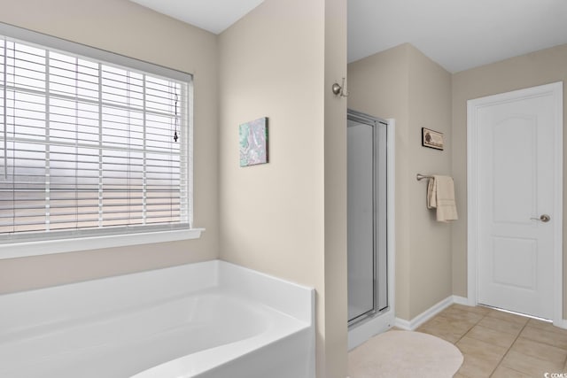 569 Ramblewood Cir, Little River, SC 29566 - full bathroom with a bath, healthy amount of natural light, a shower stall, and tile patterned flooring