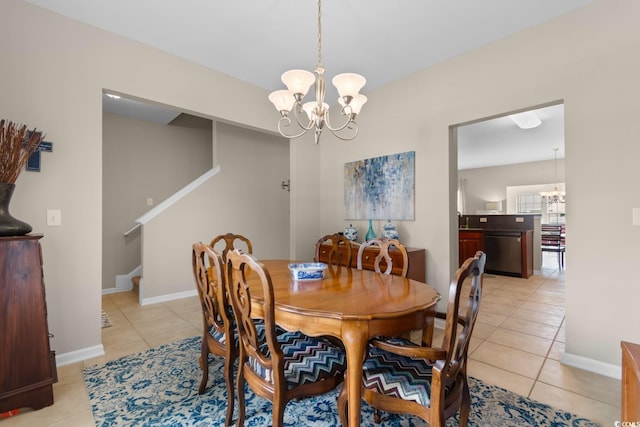 569 Ramblewood Cir, Little River, SC 29566 - dining room featuring a chandelier, light tile patterned flooring, and stairway
