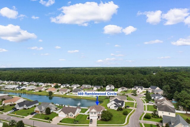 569 Ramblewood Cir, Little River, SC 29566 - aerial perspective of suburban area with a heavily wooded area and a nearby body of water
