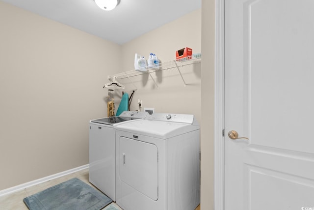569 Ramblewood Cir, Little River, SC 29566 - laundry room with washing machine and clothes dryer and baseboards