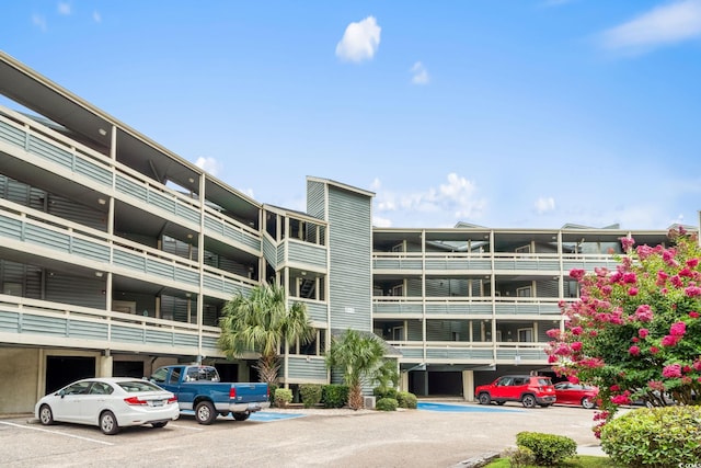 1101 Possum Trot Rd Unit A301, North Myrtle Beach, SC 29582 - view of apartment building / complex featuring uncovered parking