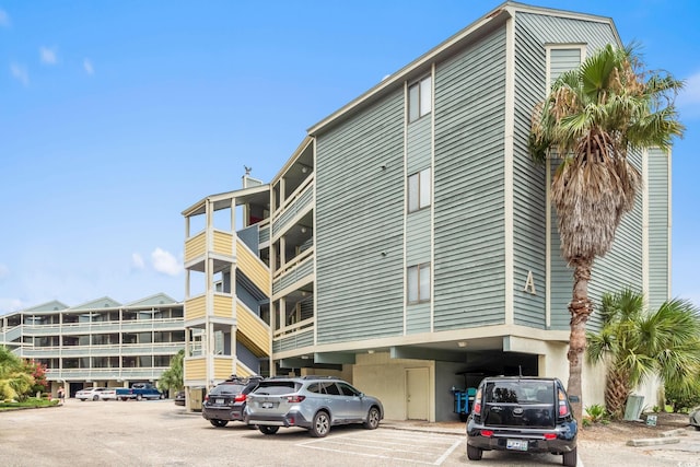 1101 Possum Trot Rd Unit A301, North Myrtle Beach, SC 29582 - view of apartment building / complex with uncovered parking