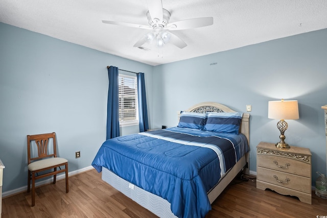 1101 Possum Trot Rd Unit A301, North Myrtle Beach, SC 29582 - bedroom with wood finished floors and a ceiling fan