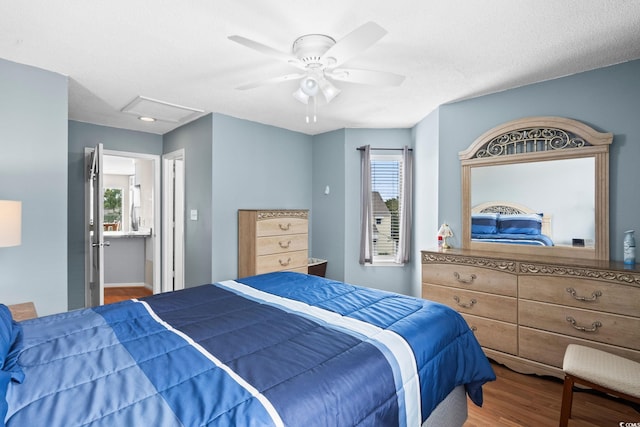 1101 Possum Trot Rd Unit A301, North Myrtle Beach, SC 29582 - bedroom with wood finished floors, multiple windows, attic access, and ceiling fan