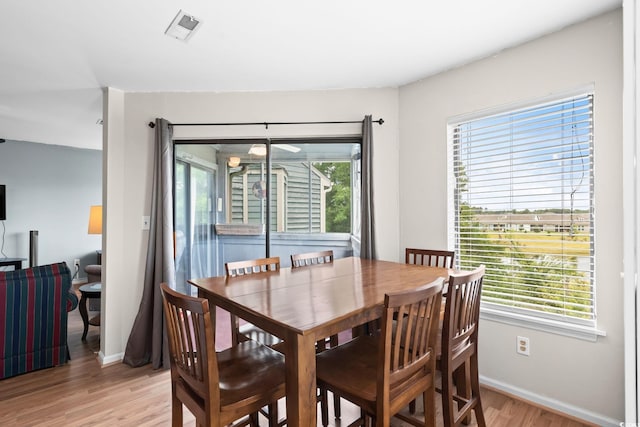 1101 Possum Trot Rd Unit A301, North Myrtle Beach, SC 29582 - dining space with light wood finished floors and healthy amount of natural light
