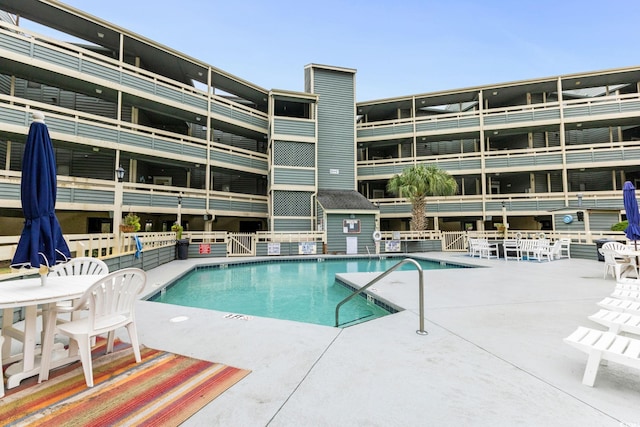 1101 Possum Trot Rd Unit A301, North Myrtle Beach, SC 29582 - community pool with a patio area