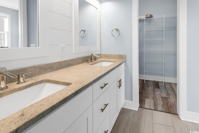 202 Clam Digger Loop, Pawleys Island, SC 29585 - full bath with double vanity, a walk in closet, and wood finished floors