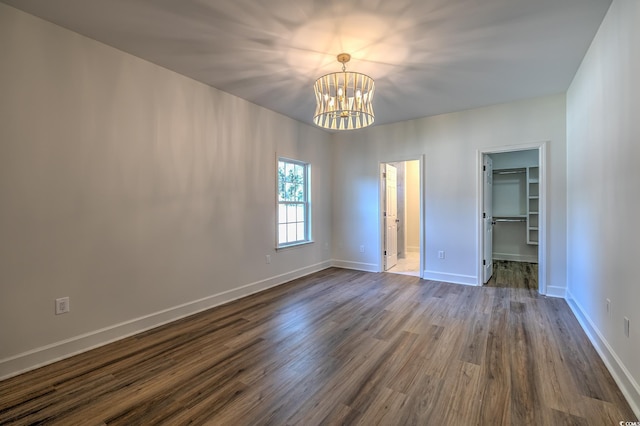 4000 Bayfield Loop, Murrells Inlet, SC 29576 - unfurnished bedroom featuring a chandelier, dark wood-style floors, and a spacious closet