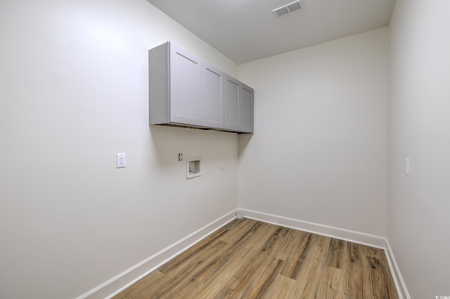 4000 Bayfield Loop, Murrells Inlet, SC 29576 - laundry room with cabinet space, hookup for a washing machine, and light wood-style flooring