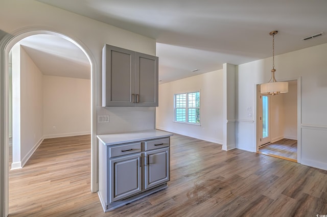 4000 Bayfield Loop, Murrells Inlet, SC 29576 - kitchen featuring gray cabinets, light wood-style floors, light countertops, and arched walkways