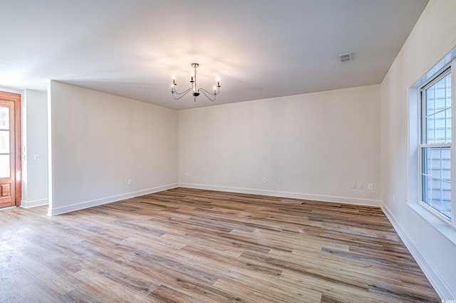 4000 Bayfield Loop, Murrells Inlet, SC 29576 - empty room with a chandelier and wood finished floors