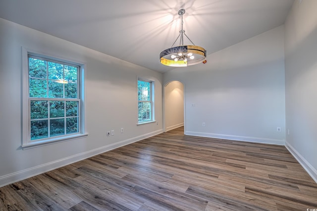 4000 Bayfield Loop, Murrells Inlet, SC 29576 - unfurnished room featuring a chandelier, arched walkways, and dark wood-type flooring