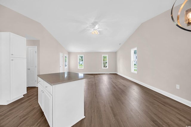 9655 Kings Grant Dr, Murrells Inlet, SC 29576 - unfurnished living room with lofted ceiling, dark wood-style floors, and a ceiling fan