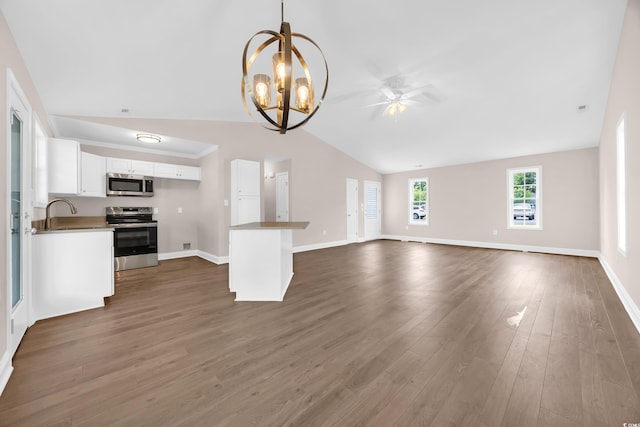 9655 Kings Grant Dr, Murrells Inlet, SC 29576 - unfurnished living room with lofted ceiling, a chandelier, a ceiling fan, and dark wood finished floors