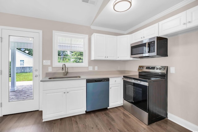 9655 Kings Grant Dr, Murrells Inlet, SC 29576 - kitchen featuring stainless steel appliances, healthy amount of natural light, white cabinetry, and crown molding