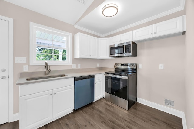 9655 Kings Grant Dr, Murrells Inlet, SC 29576 - kitchen with stainless steel appliances, dark wood finished floors, white cabinets, light countertops, and crown molding