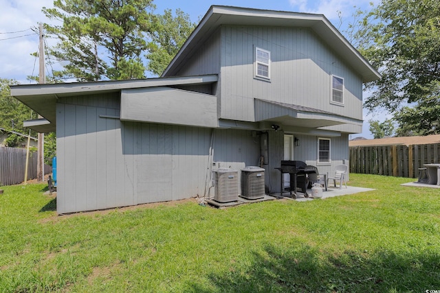 1005 28th Ave S, North Myrtle Beach, SC 29582 - rear view of house featuring a fenced backyard and a patio