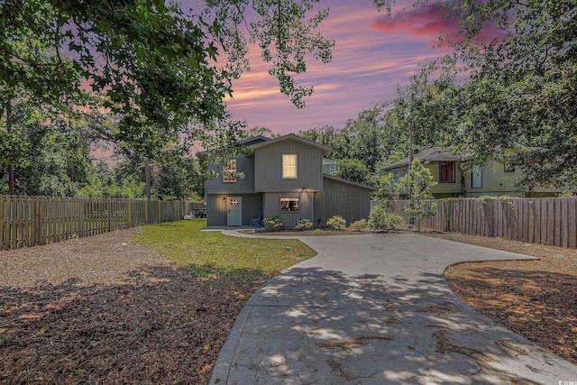 1005 28th Ave S, North Myrtle Beach, SC 29582 - view of front of property with driveway and a fenced backyard