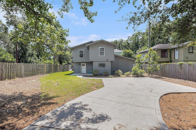 1005 28th Ave S, North Myrtle Beach, SC 29582 - view of front facade with a fenced backyard and driveway