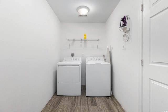 1005 28th Ave S, North Myrtle Beach, SC 29582 - laundry area with washer and dryer and dark wood-type flooring