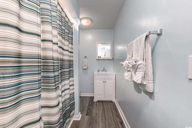 1005 28th Ave S, North Myrtle Beach, SC 29582 - full bath featuring wood finished floors, vanity, and curtained shower