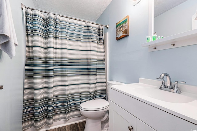 1005 28th Ave S, North Myrtle Beach, SC 29582 - full bathroom featuring a textured ceiling, vanity, wood finished floors, and a shower with curtain