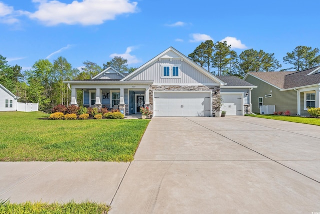 3909 On Deck Cir, Little River, SC 29566 - craftsman house featuring a porch, a garage, a front yard, driveway, and board and batten siding
