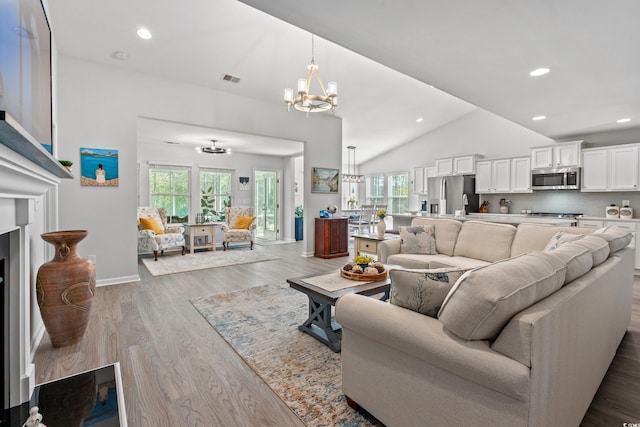 3909 On Deck Cir, Little River, SC 29566 - living area with a chandelier, healthy amount of natural light, light wood-style floors, vaulted ceiling, and recessed lighting