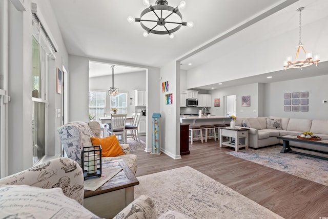 3909 On Deck Cir, Little River, SC 29566 - living area with a chandelier, light wood finished floors, recessed lighting, and vaulted ceiling