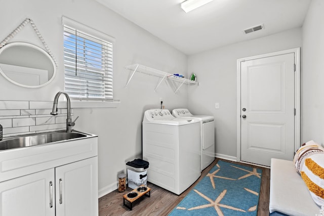 3909 On Deck Cir, Little River, SC 29566 - washroom with washing machine and dryer, dark wood-type flooring, and cabinet space