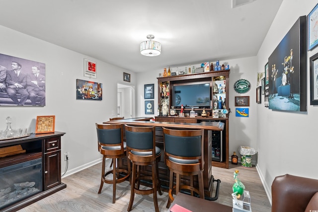 3909 On Deck Cir, Little River, SC 29566 - indoor dry bar featuring beverage cooler and light wood-style floors