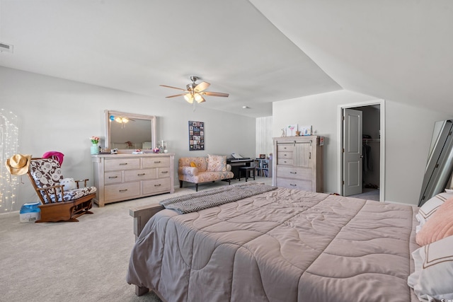 3909 On Deck Cir, Little River, SC 29566 - bedroom with light colored carpet, a walk in closet, ceiling fan, and vaulted ceiling