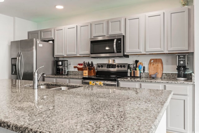 1117 Fairway Ln Unit 1117, Conway, SC 29526 - kitchen with appliances with stainless steel finishes, recessed lighting, and light stone counters