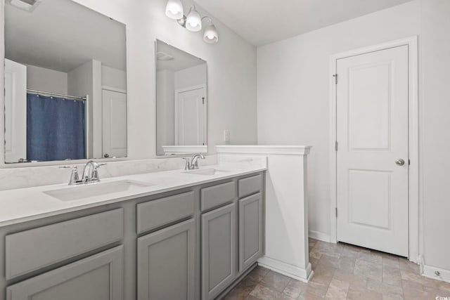 1117 Fairway Ln Unit 1117, Conway, SC 29526 - bathroom with double vanity, stone finish floors, and curtained shower