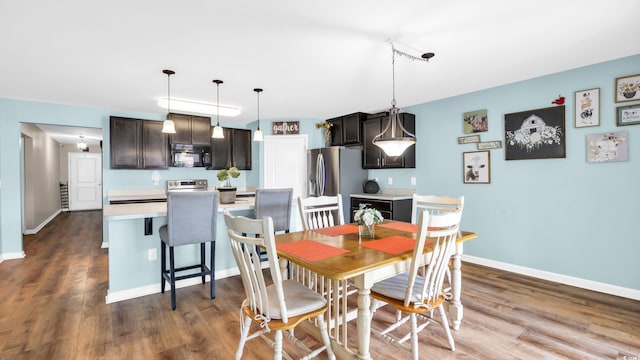 1201 Midtown Village Dr, Conway, SC 29526 - dining room featuring wood finished floors and baseboards