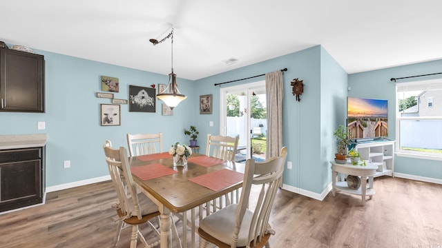 1201 Midtown Village Dr, Conway, SC 29526 - dining area featuring wood finished floors and plenty of natural light