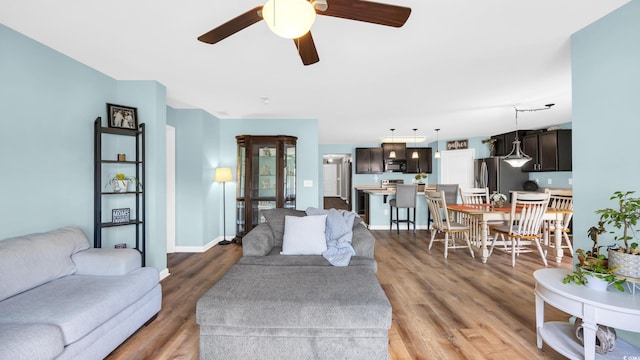 1201 Midtown Village Dr, Conway, SC 29526 - living area with ceiling fan and light wood-style floors