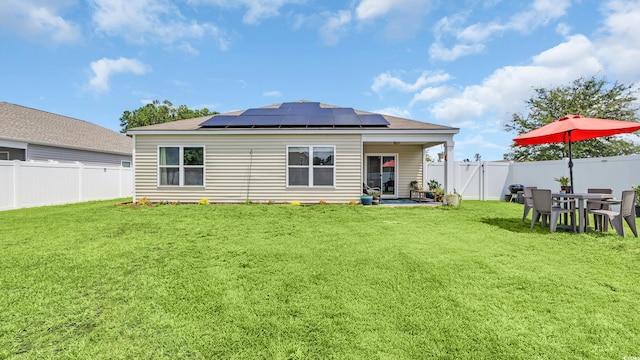 1201 Midtown Village Dr, Conway, SC 29526 - back of house featuring a fenced backyard, roof mounted solar panels, and a patio