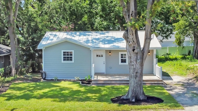 1553 Watson Ave, Little River, SC 29566 - view of front of home with a front yard, a metal roof, and a standing seam roof