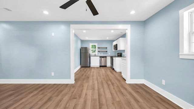 1553 Watson Ave, Little River, SC 29566 - kitchen featuring appliances with stainless steel finishes, ceiling fan, white cabinets, light wood finished floors, and recessed lighting