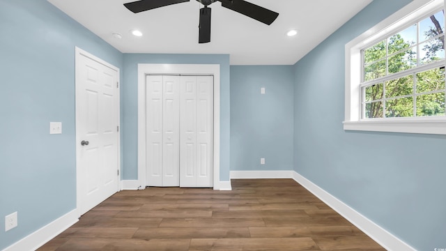 1553 Watson Ave, Little River, SC 29566 - unfurnished bedroom featuring wood finished floors, recessed lighting, a closet, and ceiling fan