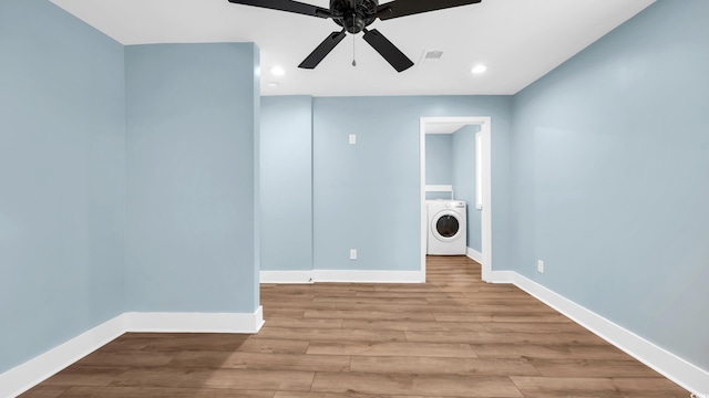 1553 Watson Ave, Little River, SC 29566 - unfurnished room featuring washer / dryer, a ceiling fan, wood finished floors, and recessed lighting