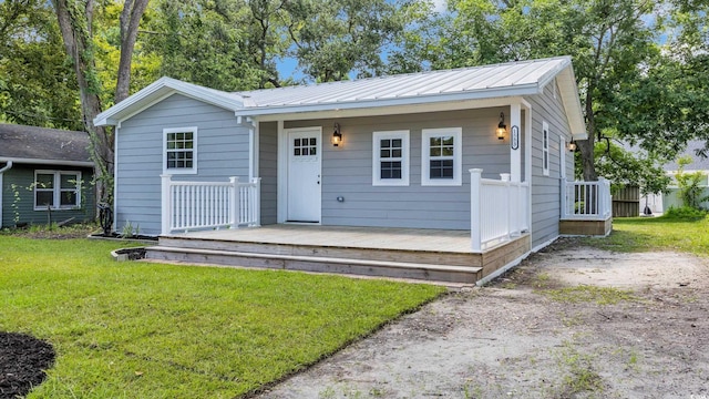 1553 Watson Ave, Little River, SC 29566 - bungalow-style home with a front lawn and a metal roof