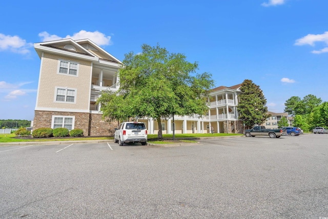 110 S Shore Blvd Unit 303, Longs, SC 29568 - view of building exterior featuring uncovered parking