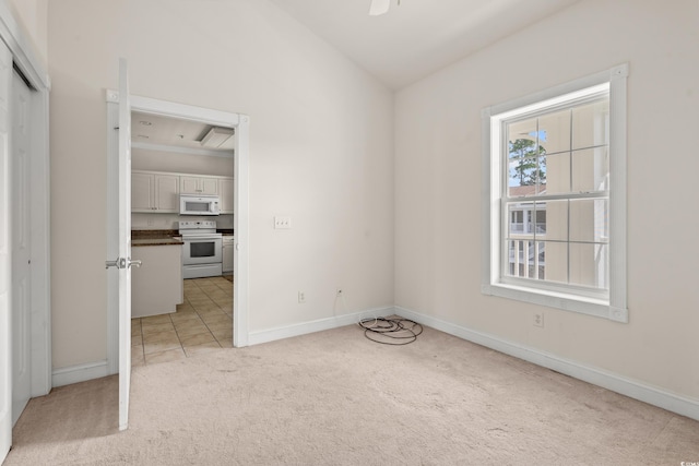 110 S Shore Blvd Unit 303, Longs, SC 29568 - spare room featuring light carpet and a ceiling fan