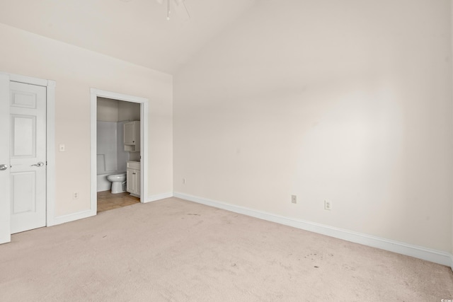 110 S Shore Blvd Unit 303, Longs, SC 29568 - unfurnished bedroom featuring light carpet, connected bathroom, and high vaulted ceiling